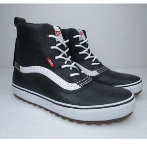 Vans Black and White mid snow mate women’s boots size 8.5 
Men size 7